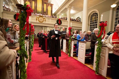 “They are great tunes,” said Harvard choirmaster Edward E. Jones of “Jingle Bells” and “Sleigh Ride” — traditional holiday songs with a Harvard connection. Jones is seen here leading the 104th Annual Christmas Carols Service in Memorial Church.