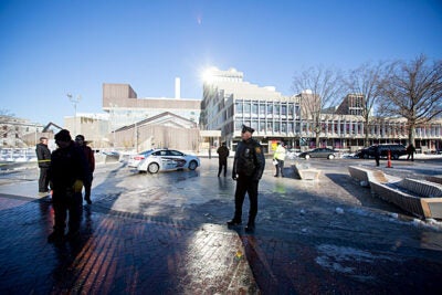 The Yard was restricted to Harvard ID holders for several hours but all four buildings were cleared and reopened by shortly before 3 p.m., as campus life returned to normal on the first day of final exams. President Drew Faust (photo 2) chatted with students temporarily relocated to Annenberg Hall.