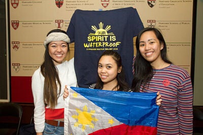 “Being so far away, I feel that the distance makes it really difficult to fully comprehend what has happened and what is going on in terms of relief efforts,” said Michelle Ferreol '15 (right), who, along with fellow Harvard Philippine Forum members Shannen Kim '15 (left) and Riana Jumamil '14, is launching a T-shirt line to further fundraising efforts for those affected by Typhoon Haiyan.  