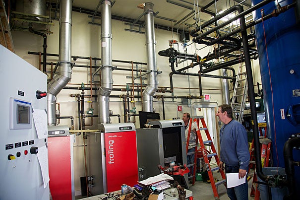 The Harvard Forest's new, super-efficient, thermal biomass system, which provides heating to five nearby buildings via wood-fired boilers, offers a functional tool for research (photos 1, 2). The woods crew focuses on taking low-quality material out of the forests for use as biomass, therefore improving the growth and quality of trees with a higher economic and ecological value (photo 3). 
