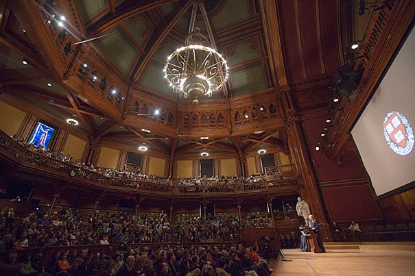 “Thank you for your children. They are remarkable people,” said President Drew Faust in welcoming the parents of the Class of 2015 (photo 1).  Joining Faust in Sanders Theatre was interim Dean Donald Pfister, who encouraged the juniors to embrace the unique opportunities afforded them at the College (photo 2). Frederick Freyer '83 (from left, photo 3) and Jaye Freyer joined their son Jake '15 for the festivities.