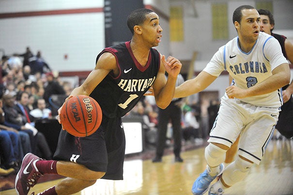 Siyani Chambers '16 went up against Columbia's Isaac Cohen (photo 1). Wesley Saunders '15 (photo 2) had 10 points, seven assists, and two steals. Brandon Curry '14 (photo 3) moved past Columbia's Meiko Lyles as Harvard beat Columbia 80-47.