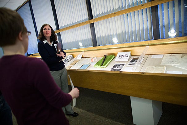 Sharyn Nolan (right) and Juliana Kuipers lead visitors through “Code Books to 'Love Story': Staff Selections from the Harvard University Archives’ Collections.” This inaugural staff exhibit, eccentric and surprising, is up through May 15.