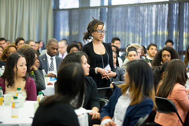 The second Ivy Plus Symposium attracted 130 undergraduates,  such as Natalie Cook from the University of Wisconsin, Madison (standing, photo 1), and 19 program directors from across the country. The event was aimed at giving them the chance to get an up-close-and-personal view of graduate student life from current Ph.D. candidates; to network with nearly 60 faculty members, including 20 Harvard faculty, alumni, and administrators; and to get to know each other. 