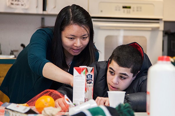 At a youth center in Cambridge, Harvard students brought science into the kitchen. Harvard junior Bonnie Lei (left, photo 1) and Dennis Friendly-Akers compared the composition and taste of various dairy and non-dairy milks, while Prerna Bhat (right, photo 2) and Jahmaya Adamson did the same thing, starting with cow's milk. Sicheng Wu wanted the taste of fresh juice so he made his own (photo 3). 