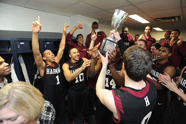 The Harvard men's basketball team celebrated after being presented with the Ivy League trophy. Harvard beat Yale, 70-58.