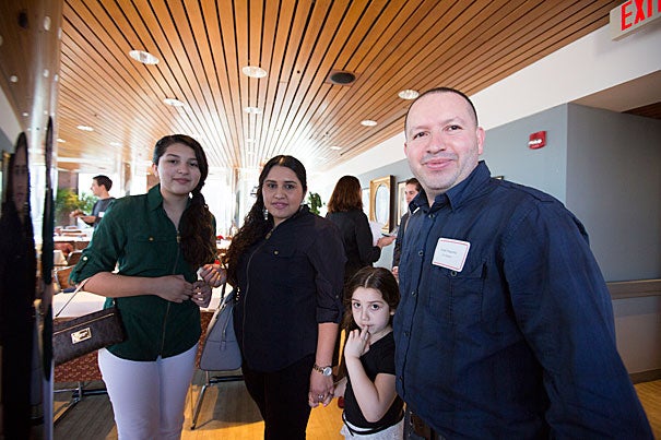 “I’ve been waiting on this moment for a long time and finally it’s here,” said Israel Argueta (photo 1), who was joined by his partner, Sulma Garcia, and daughters Kimberly, 12, and Kelsey, 5, at the Bridge Program's annual dinner. Margarita Pleitez (left, photo 2) and her mentor, Mariana Gudino, talk with President Drew Faust. Juan Carlos Martinez Roa (right, photo 3) is congratulated by mentor Colin Diersing '16.