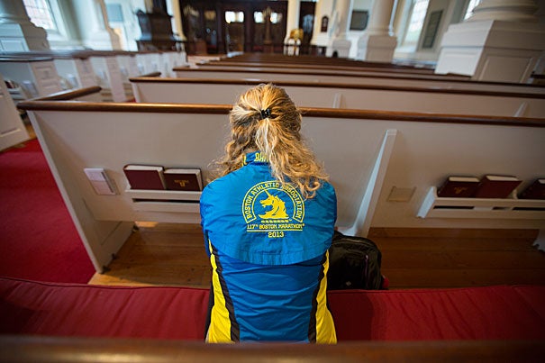Madeline Cooper '16 (photo 1) said she will run the Boston Marathon again this year. Cooper and Patrick Rooney '14 (photo 2), who ran the marathon last year, were at the Memorial Church for a quiet moment of remembrance. Harvard landscaper Danny Mata (photo 3) prepared the church for the day's events by placing daffodils on its steps.
