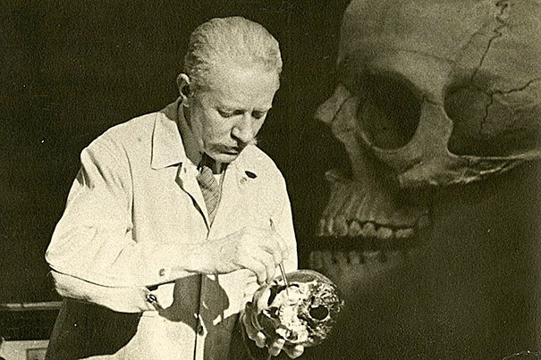 Surgeon and anatomist Robert M. Green (photo 1) lectures at Harvard Medical School in 1941, standing in front of a large-scale wood pulp model of the skull made in the 1890s. Illustrations (photo 2) from Juan Valverde de Amusco’s “Anatomia del corpo humano” (1560).  A 1610 engraving of the anatomical theater of Leiden University (photo 3). 