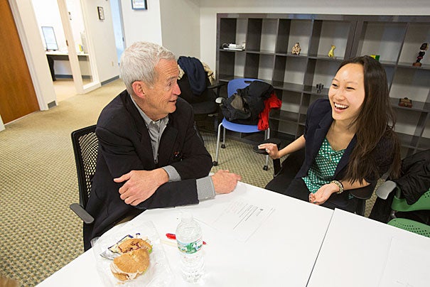 New to social media, Tom Kelly (left, photo 1) still found common ground with Michelle Luo ’14, who has been a teaching fellow for CS50 and an intern at Google. Judith Singer (from left, photo 2), senior vice provost for faculty development and diversity, remembered signing up for Facebook in its early Harvard-only days. Director of the Harvard Global Health Institute Sue Goldie said she uses Twitter in a  targeted manner, to make sure her kids are not in any trouble.