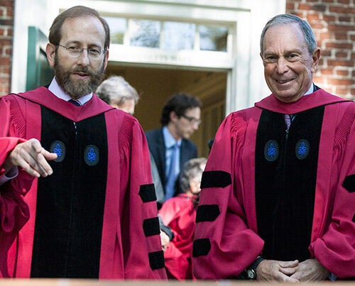 Harvard Provost Alan M. Garber (left, photo 1) and Michael R. Bloomberg, the principal speaker at Afternoon Exercises, prepare for the walk to Tercentenary Theatre to begin the morning portion of Commencement. President Drew Faust (photo 2) shares a moment with former President George H.W. Bush. Evelynn Hammonds (left, photo 3) escorts Aretha Franklin, one of the eight honorary degree recipients.