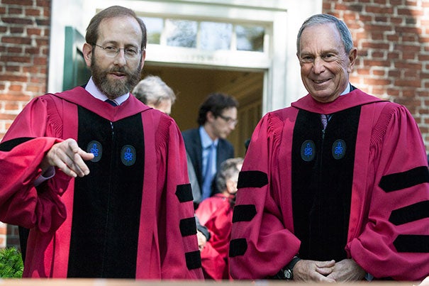 Harvard Provost Alan M. Garber (left, photo 1) and Michael R. Bloomberg, the principal speaker at Afternoon Exercises, prepare for the walk to Tercentenary Theatre to begin the morning portion of Commencement. President Drew Faust (photo 2) shares a moment with former President George H.W. Bush. Evelynn Hammonds (left, photo 3) escorts Aretha Franklin, one of the eight honorary degree recipients.