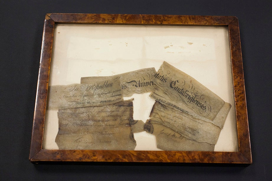 The remains of the 1849 A.B. diploma of Edward Lorenzo Holmes. Tucked into a safe, it survived the fire of 1871 — although “it is clearly evident,” wrote heir and donor Randolph W. Holmes in 1929, “that the ‘sheep skin’ has turned to a substance analogous to glue.”
