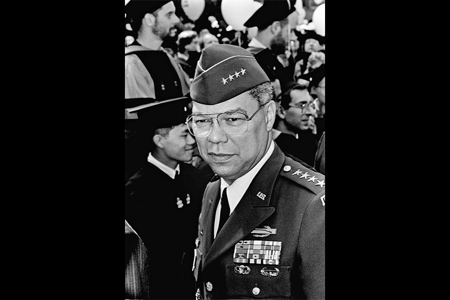 Gen. Colin Powell, chairman of the Joint Chiefs of Staff during the Persian Gulf War, makes his way through the crowd in Harvard Yard before delivering his Commencement address in 1993. Powell was secretary of state from 2001 to 2005, the first African-American to serve in that position. Photo by Michael Quan