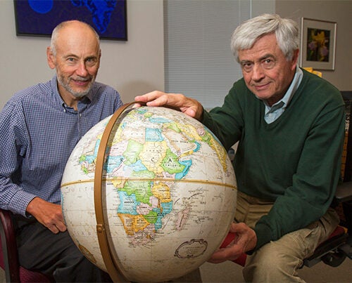 Harvard School of Public Health AIDS Initiative Chair Max Essex (right) has joined with a group of collaborators on the Botswana Combination Prevention Project, a massive trial enrolling more than 100,000 people, age 16 to 64, living in 30 villages across the country. Harvard Professor Victor De Gruttola (left) said faculty and students have devoted years to refining statistical methods to aid in design, monitoring, and analysis of the trial. 