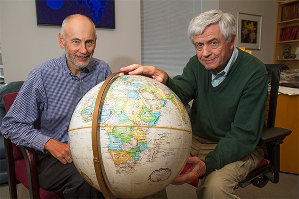 Harvard School of Public Health AIDS Initiative Chair Max Essex (right) has joined with a group of collaborators on the Botswana Combination Prevention Project, a massive trial enrolling more than 100,000 people, age 16 to 64, living in 30 villages across the country. Harvard Professor Victor De Gruttola (left) said faculty and students have devoted years to refining statistical methods to aid in design, monitoring, and analysis of the trial. 