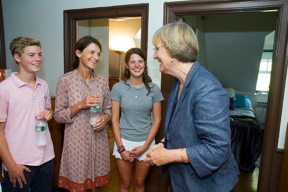 President Drew Faust greets Thomas Slack, his mother, Sarah, and incoming freshman Lucy Slack. Jon Chase/Harvard Staff Photographer