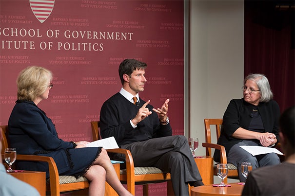 The fight to end the Ebola epidemic is not just about saving lives, it’s also about heading off a potentially broader humanitarian crisis, according to a Harvard Kennedy School panel, which included (seated from left) moderator Sheila Burke, Michael VanRooyen, director of the Harvard Humanitarian Initiative, and Dyann Wirth, Richard Pearson Strong Professor of Infectious Disease at Harvard. 