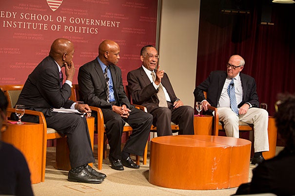 A panel convened by Professor Charles Ogletree (from left) reflected on the broad social, legal, and political issues raised by the protests in Ferguson, Mo., last month. “I’m not alleging any type of conspiracy. Just know that many people — minority and majority — think something is terribly wrong,” said the Rev. Ray Hammond. Also on the panel were Lee P. Brown, the first African-American commissioner of police for Atlanta, and Alex Jones, director of the Shorenstein Center.
