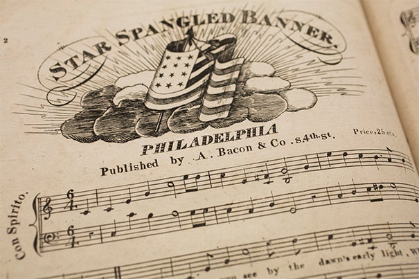 Houghton Library's collection includes an early edition of the "The Star-Spangled Banner," likely printed sometime between 1816 and 1821 (photo 1). An illustration of the flag that inspired the piece was included in a packet of material printed as souvenirs for collectors (photo 2). Francis Scott Key (photo 3) as pictured in a book at Houghton.