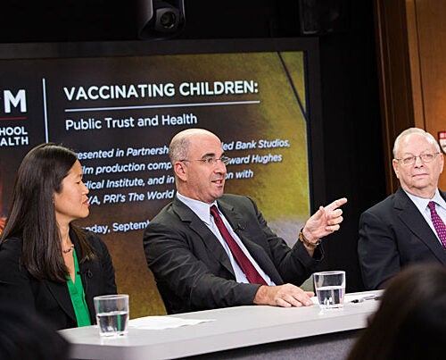 A School of Public Health Forum had experts examining the rise in parents refusing to vaccinate their children. Richard Malley (center) of Boston Children's Hospital suggested extending outreach beyond pediatricians by educating general practitioners on ways to reinforce accurate information about vaccinations. Joining in the conversation were HSPH Associate Professor Jane Kim,  Professor Barry R. Bloom, and Seth Mnookin of MIT (not pictured).