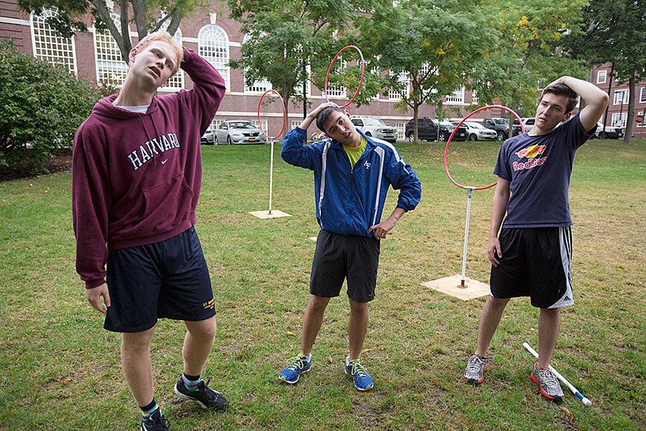 Martin Reindl ’15 (from left), Phillip Ramirez ’18, and Anthony Ramicone ’15 stretch before practice.