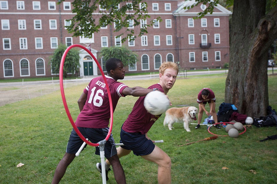 Ernest Afflu ’15 (left) and Martin Reindl ’15 vie for the quaffle — the name of the volleyball in Quidditch. 