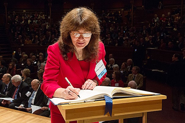 Joanna Aizenberg, the Amy Smith Berylson Professor of Materials Science, signs the American Academy of Arts and Sciences’ Book of Members, a tradition that dates back to 1780.