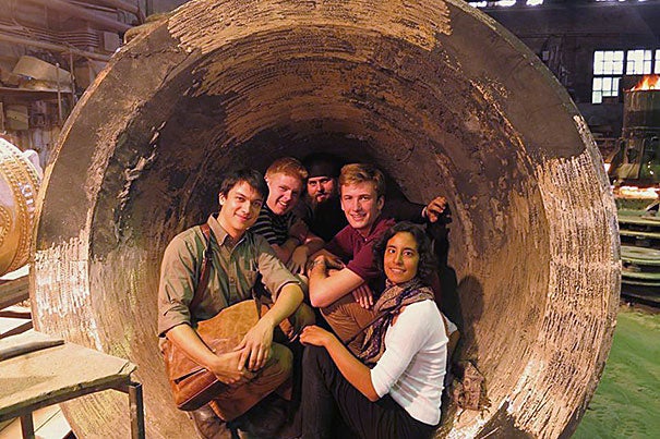 Christopher Wankel '13 (from left), Harry Hild '16, Father Roman, Dylan Perese '16, and Harvard teaching fellow Amy Koenig are pictured at the Litex Foundry in Moscow.