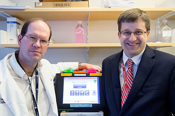 Dr. Jon Aster, Professor of Pathology, left, and Dr. David Steensma, Associate Professor of Medicine, have developed a rapid screening test for the genetic profile of blood cancers, which allow them to identify variations and apply targeted therapy specific to that kind of tumor. Jon Chase/Harvard Staff Photographer