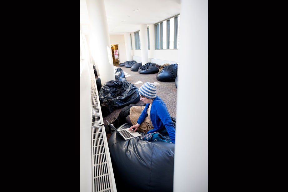 HLS student Anna Byers works in Beanbag Alley, located on the third floor of Langdell Hall.