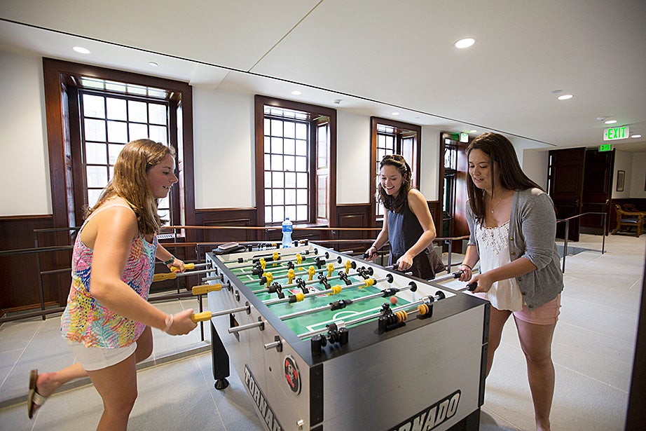 Undergraduates Megan McLaughlin '16 (from left), Joan Timmins '16, and Christine Cahill '16 are pictured inside McKinlock Hall. Rose Lincoln/Harvard Staff Photographer 