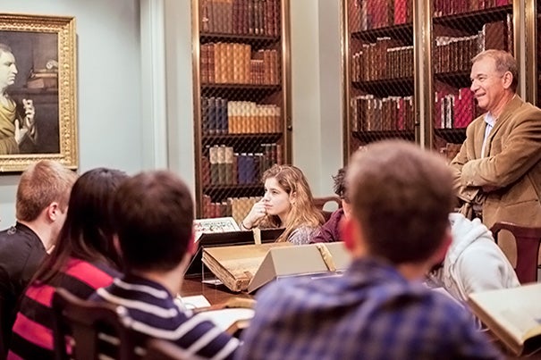 At Houghton Library, Harvard Shakespeare scholar Stephen Greenblatt (far right), guides Humanities 10a students through a look at first editions and other treasures. 