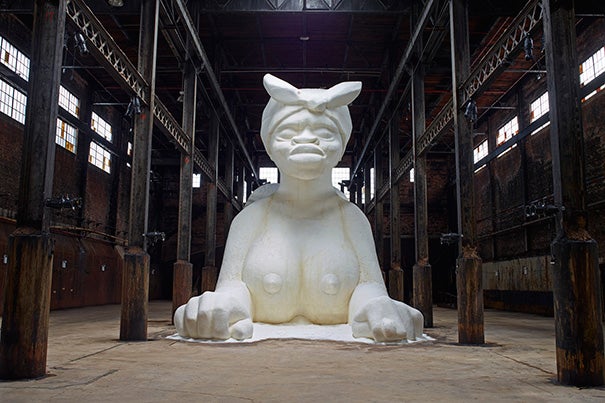 Artist Kara Walker created “A Subtlety" from 80 tons of granular sugar (photo 1). Walker, who spoke at Radcliffe, met with students beforehand to discuss her work (photos 2, 3). Although best known for her largely confrontational work, Walker calls herself “a reluctant activist,” one who spent her formative years thinking that she would follow in the footsteps of her father, the painter and art professor Larry Walker, and avoid such loaded topics in favor of more “universal” themes.