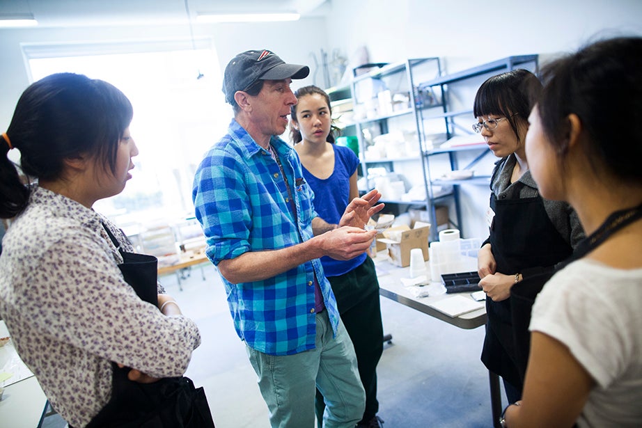 Wayne Fuerst teaches “Adornment: Basic Jewelry Smithing with Silver Clay” at the Harvard Ceramics Program. Eliza Chang ’16 (from left), Fuerst, Cristina Parajon ’18, and Rebecca Chen ’16 look at jewelry examples. Stephanie Mitchell/Harvard Staff Photographer