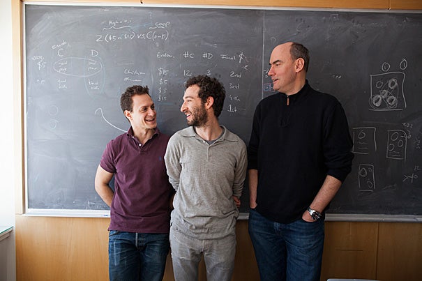 “For years, people have been asking those of us who study cooperation about the motive that is behind an action,” said Harvard Professor Martin Nowak. Nowak (from right), Moshe Hoffman, and Erez Yoeli have developed a first-of-its-kind model, dubbed the “envelope game,” that can help researchers to understand not only why humans evolved to be cooperative but why they evolved to cooperate in a principled way.