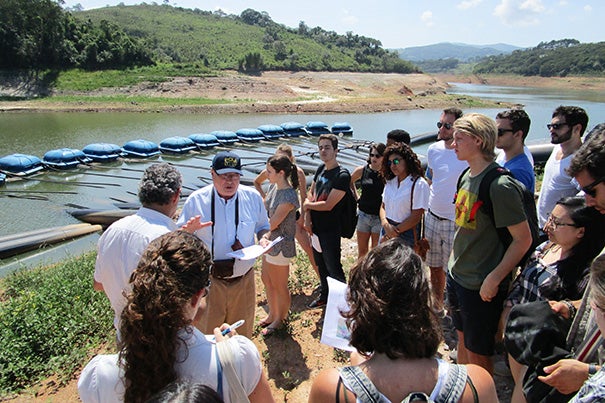 Sustainability issues in urban cities brought together Harvard and Brazilian students during a 10-day workshop in São Paulo. Professor Rubem Porto explained the current state of the severe drought in the Sistema Cantareira reservoir system near the temporary floating pumps used to extract water from the dead space of the reservoir.