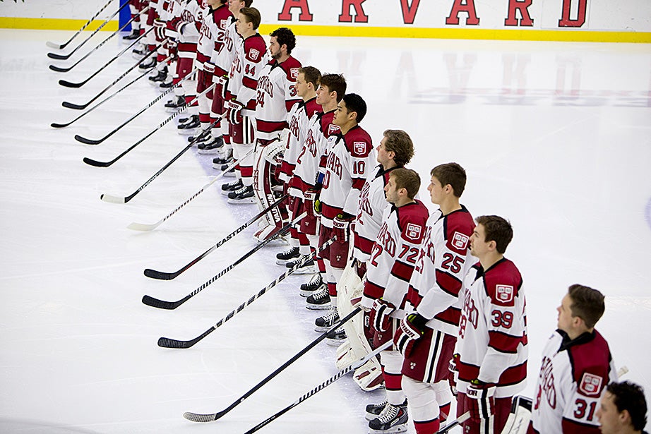 The Harvard men’s hockey team stands for introductions before playing Clarkson at Bright-Landry Hockey Center on Jan. 16. Rose Lincoln/Harvard Staff Photographer