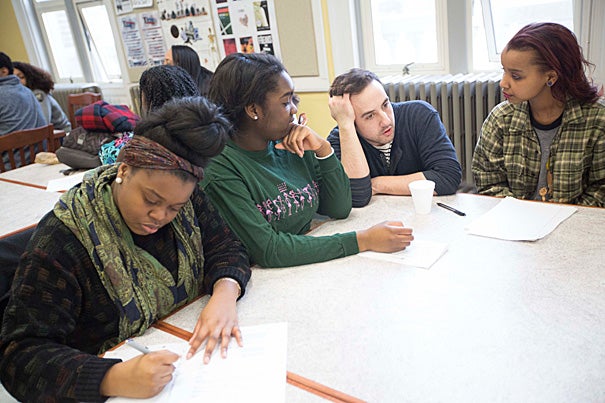 Brendan Shea (third from left), manager of education and community programs at the American Repertory Theater (A.R.T.), worked with Boston Green Academy seniors Kimberly Kirlew (from left), Joyce Ogbesoyen, and Ester Farah during a workshop that focused on the A.R.T.'s production of Suzan-Lori Parks’ “Father Comes Home From the Wars (Parts 1, 2, & 3).”