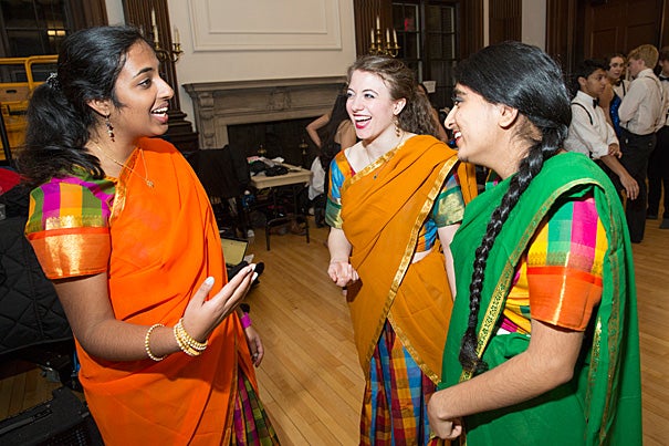 As the largest student-run production, Ghungroo allows the students to tap their talents. Priyanka Kumar '18, (from left, photo 1), Lia Raynor '17, and Herman Kaur Bhupal '16 share a laugh after assisting each other with their outfits. Even the traditional — men in white shirts and suspenders — finds a place in the production (photo 2). Dancers practice before the show at First Church in Cambridge (photo 3). “We’re not technique-oriented,” explained Radhika Rastogi ’15, the dance director. “We’re not out to impress the audience. It’s always more about energy and enthusiasm.”