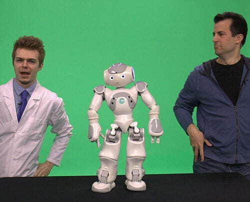 David Malan (right), Gordon McKay Professor of the Practice of Computer Science, technologist Colton Ogden from CS50/CS50x, and a special robotic guest incorporated live broadcasts into their MOOC, “Introduction to Computer Science.” 
