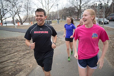 Miguel Perez-Luna '15, who is organizing a bus that will take members of the Harvard community to the starting line in Hopkinton, often trained on a treadmill during the winter months. Anna Dolan '15 also hit the treadmill at the Malkin Athletic Center. Recently the pair connected with members of the Harvard College Marathon Challenge for an outdoor run along the Charles River, minus the snow.