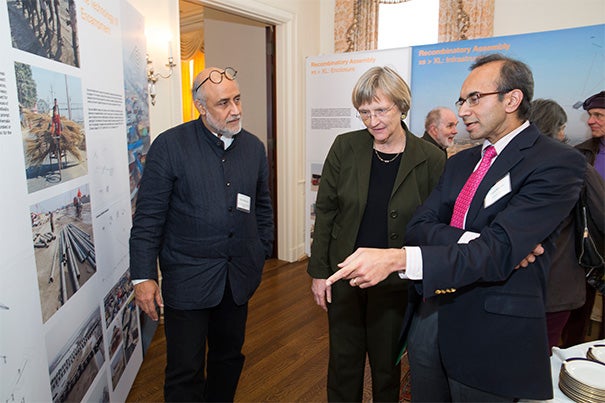 The Harvard Kumbh Mela team gathered at Loeb House to reflect on the experience and to launch a book and exhibit on their findings, “Kumbh Mela: Mapping the Ephemeral Megacity." Professor of Urban Design and Planning Rahul Mehrotra (from left), President Drew Faust, and Tarun Khanna, director of the South Asia Institute, discussed the exhibit. Khanna, born in India, set aside his professorial mien when he took his parents to the festival and took a ritual bath in the river water. 