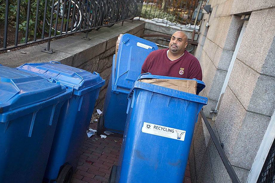 Alex Gonsalves collects recycling outside Adams House. Waste per capita was reduced 27 percent from FY2006 to FY2014. Kris Snibbe/Harvard Staff Photographer 