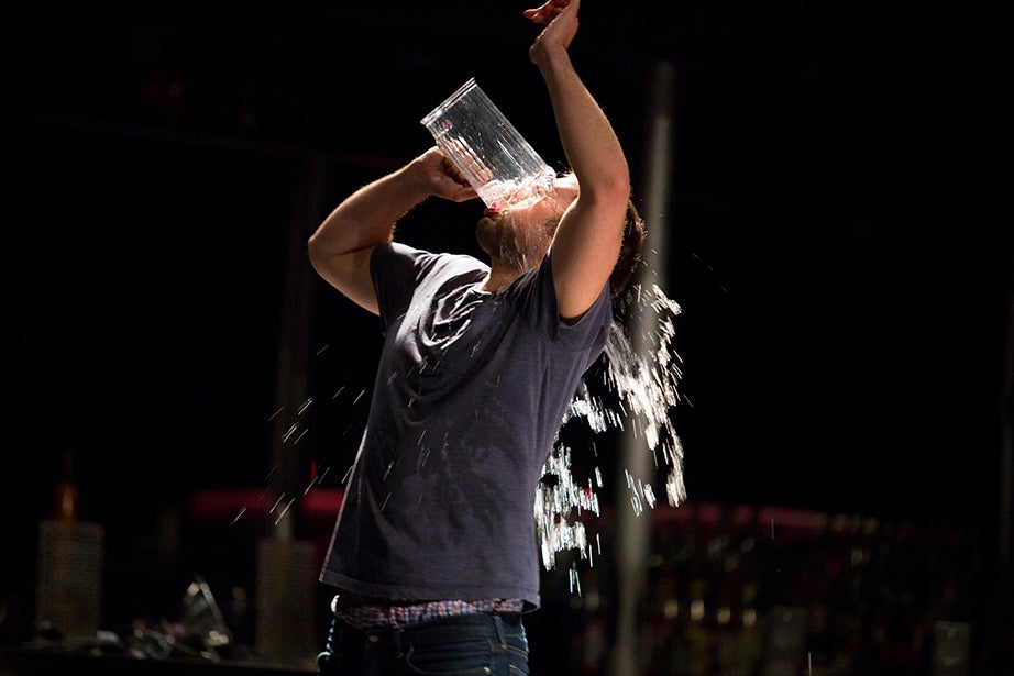 Max McGillivray ’15 doesn’t mind getting drenched during a scene. Stephanie Mitchell/Harvard Staff Photographer
