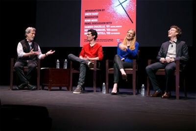 Professor of Visual and Environmental Studies Robb Moss (from left) interviewed "Whiplash" writer and director Damien Chazelle '07 and co-producers Helen Estabrook '03 and Nicholas Britell ’03 about the success of their low-budget film that became an Oscar-winning hit. 