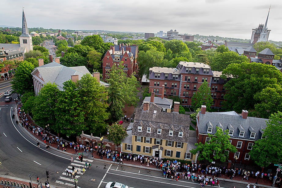 The line to enter the Harvard’s 364th Commencement Exercises wrapped around the block on Massachusetts Avenue. Rose Lincoln/Harvard Staff Photographer