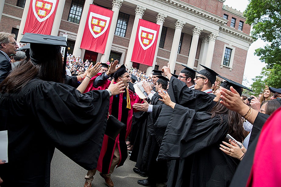 Danoff Dean of Harvard College Rakesh Khurana walks through graduates. Rose Lincoln/Harvard Staff Photographer