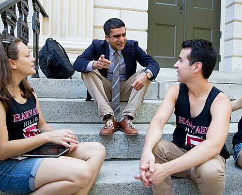 Harvard College Dean Rakesh Khurana is pictured on freshman move-in day with students on the steps of University Hall. "I think this year has been a time of active discussion about how we create a more inclusive Harvard community," Khurana said.