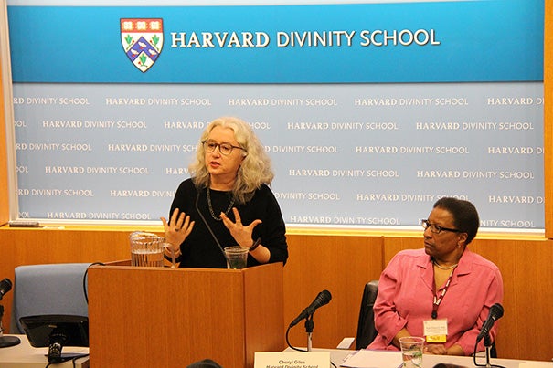 Buddhist ministers in the Western world are going out and working in hospitals and prisons with people who are not exclusively Buddhist. That can lead to a generalization or abstraction of certain types of practices such as mindfulness and compassion, said Harvard Professor Janet Gyatso (at podium). Cheryl Giles (right), lecturer on pastoral care and counseling, later talked about her transition from being a Roman Catholic to a practitioner of Buddhism.